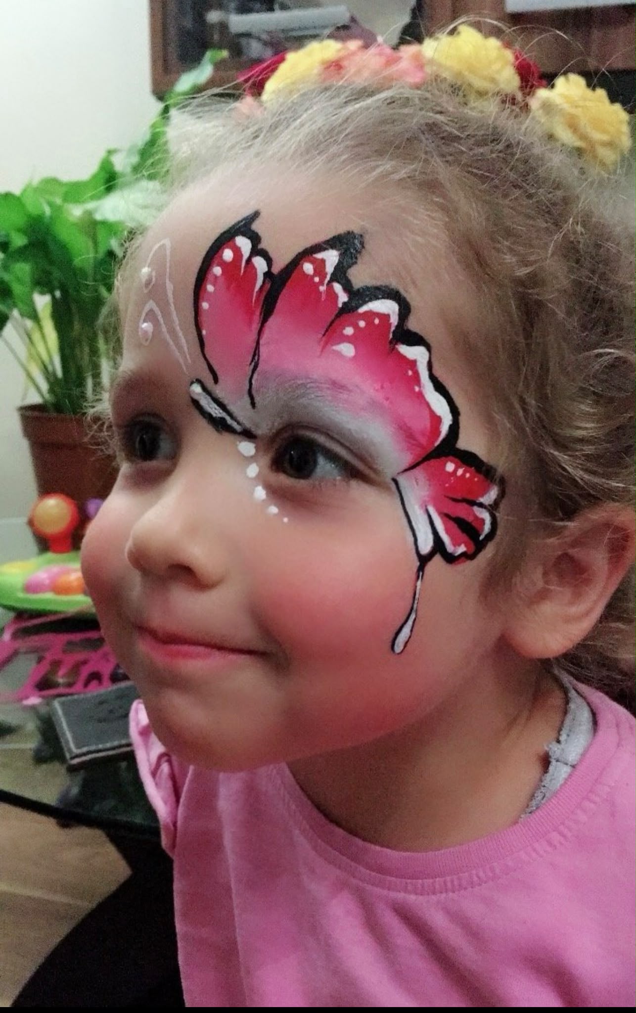 Pink butterfly face painting